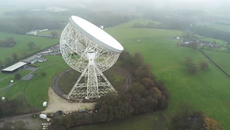 aerial jodrell bank observatory lovell telescope misty rural countryside rear view orbit right