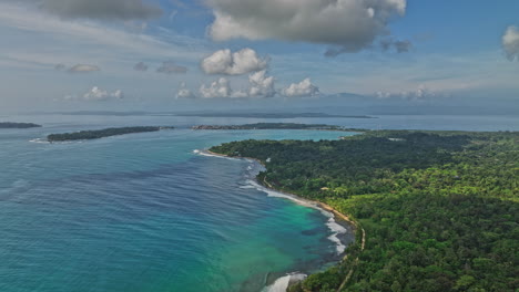 bocas del toro panama aerial v6 dolly in flyover paunch beach towards big creek capturing beautiful turquoise blue seascape and tropical forest - shot with mavic 3 cine - april 2022