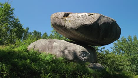 scenic balance stones on the slopes at pena do equilibrio in ponteareas, pontevedra, spain. closeup shot