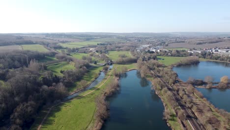 Flying-over-a-small-blue-lake-in-Kent-England