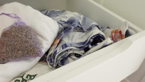 lavender sachet in a drawer with linens
