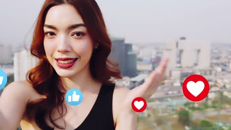 portrait of smiling pretty young  woman using phone on rooftop city bangkok.female using mobile phone make vlog and live in social media .