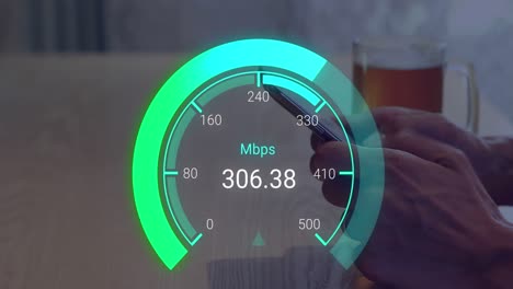 animation of green speedometer over hands of biracial man using smartphone