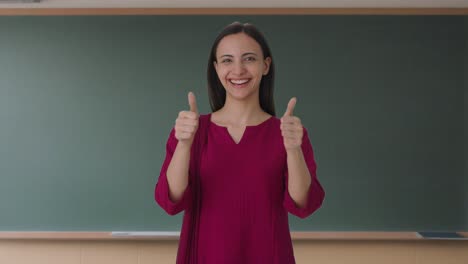happy indian female teacher showing thumbs up