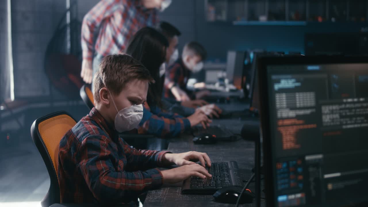 Students in a computer lab learning to code