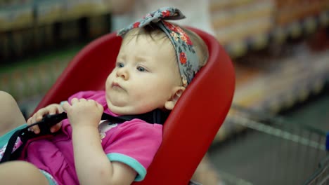 child-sits-in-a-specially-equipped-chair-11-in-the-supermarket-7