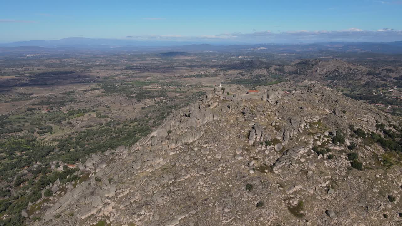 Aerial circling around ancient Monsanto castle and surrounding landscape in Portugal