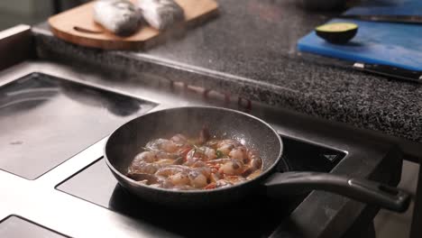 cooking shrimp in a pan