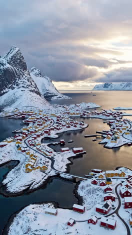 aerial view of a snowy fishing village in the lofoten islands, norway