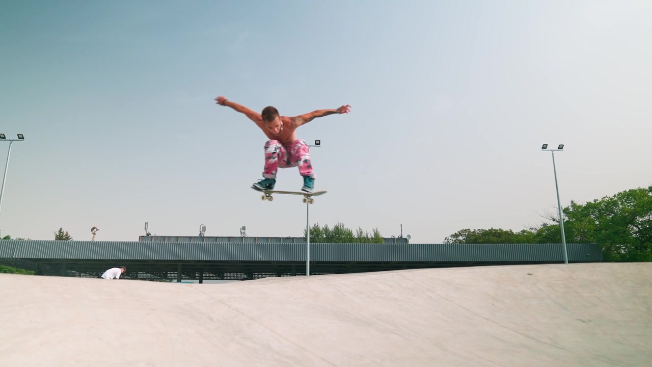 Young Skateboarder Performs Ollie Trick in Slow Motion at Skatepark