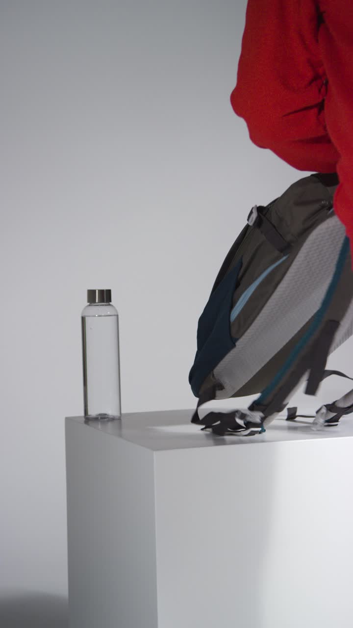 Vertical Shot of Girl Picking Dumbbells