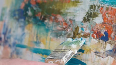 super slow motion 240 fps the artist paints an abstract picture in the studio - super slow motion 240 fps, the artist paints an abstract picture in the studio. a modern artist paints an emotional, sensual oil painting