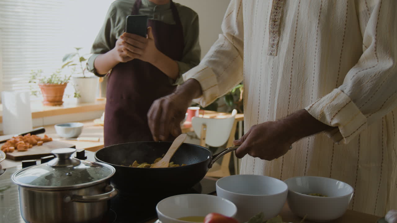 Father and Son Cooking Together in the Kitchen