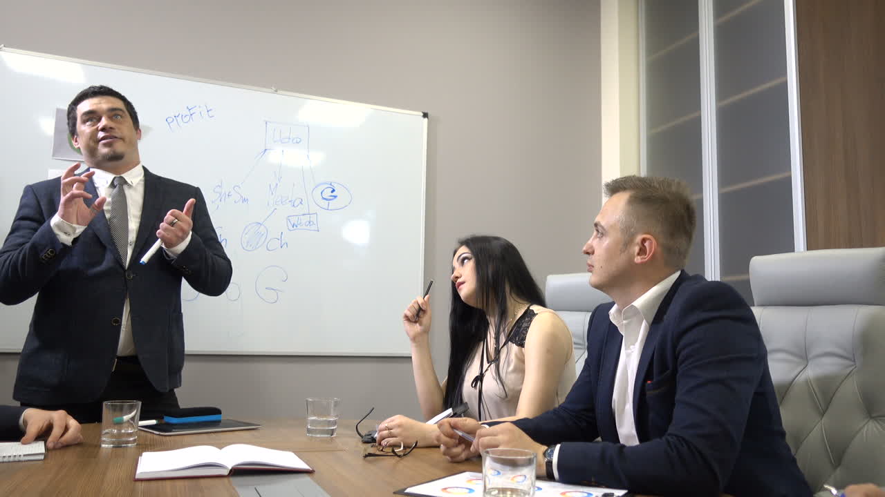 Board Meeting In Modern Office. Business people having board meeting in modern office