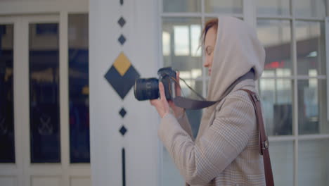 woman taking photos on the street