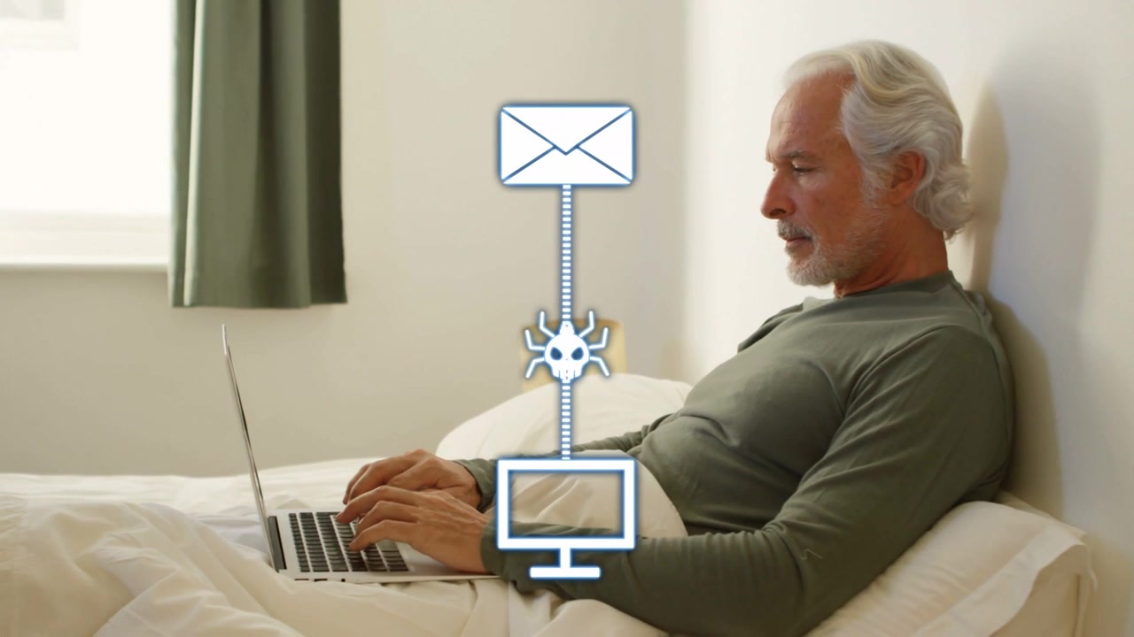 Senior man typing in bed, envelope sending malware to laptop, security shield blocking threat