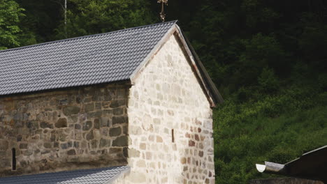 Monastic-church-with-holy-cross-on-renovated-roof,-Mtsvane-monastery