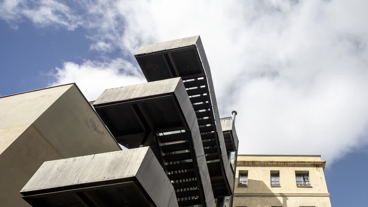 Old factory chimney and apartment buildings in barcelona