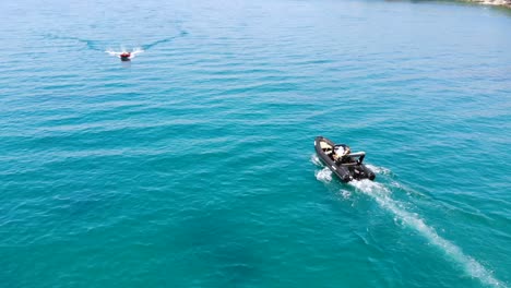 Aerial-drone-shot-of-a-fly-over-a-speed-boat