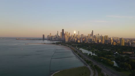 Drone-Descending-Above-North-Avenue-Beach,-Lincoln-Park-in-Chicago-on-Summer-Day