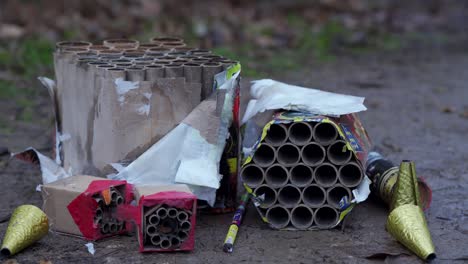 used burnt fireworks, firecrackers on pavement after explosion in holiday, birthday, new year, christmas celebrations.