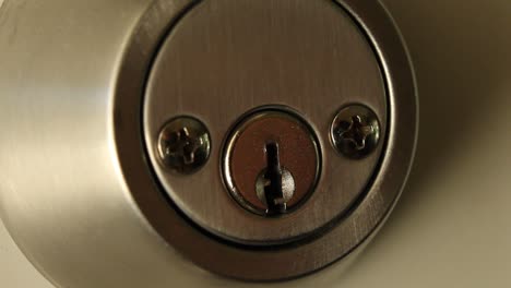 key inserted into deadbolt door lock residential medium close