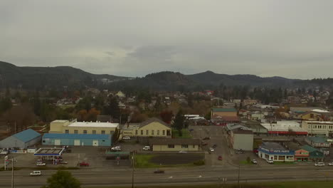 City-of-Coquille-in-Southern-Oregon-Coos-County-aerial-drone-video-showing-buildings-and-Highway-42