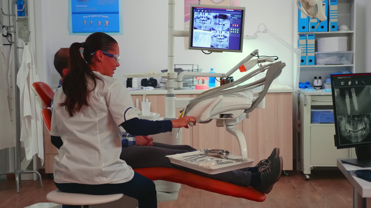 Doctor examining teeth with medical instruments