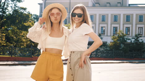 two young women enjoying a sunny day in the city