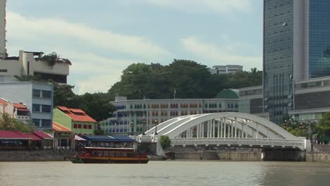 boat tour on singapore river in a sunny day