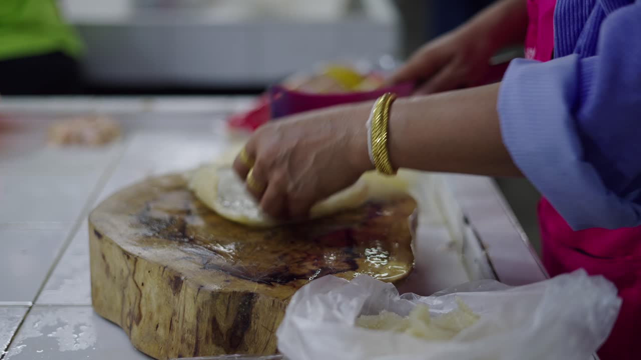 Woman preparing food at a market