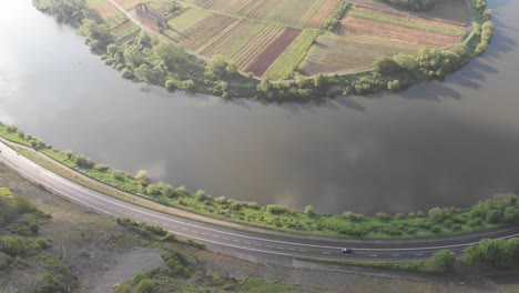 Scenic-aerial-drone-view-of-Mosel-Valley-in-Germany,-tilt-up-reveals-vineyard