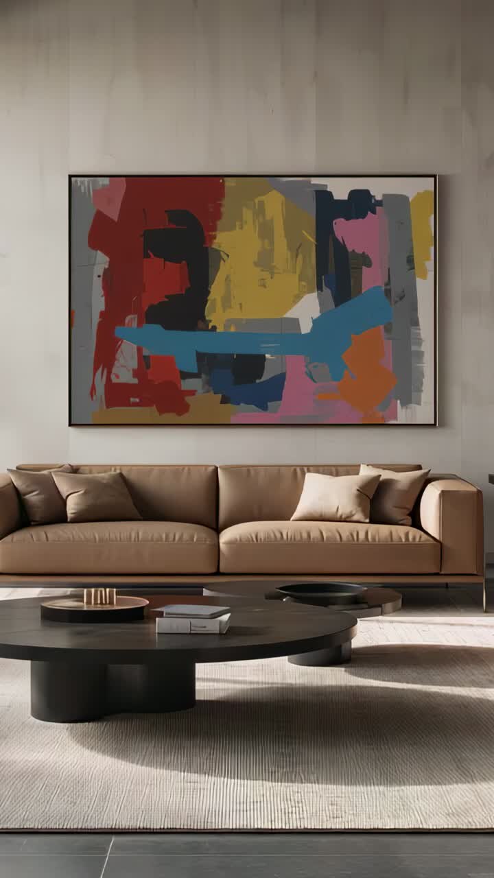 Vertical video: Starting camera moving inward in living room, showing painting detail above sofa