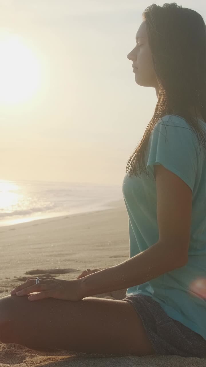 Finding inner peace on a serene beach at sunrise