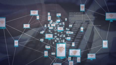 Animation of networks of connections with icons over hands typing on keyboard