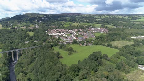 Aerial decent towards Llangollen town towards aqueduct and canal