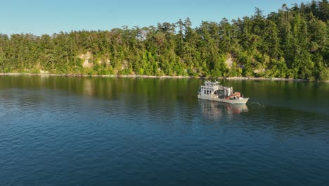 Aerial-shot-of-a-fisherman's-seafaring-boat-anchored-off-near-Coupeville,-Washington