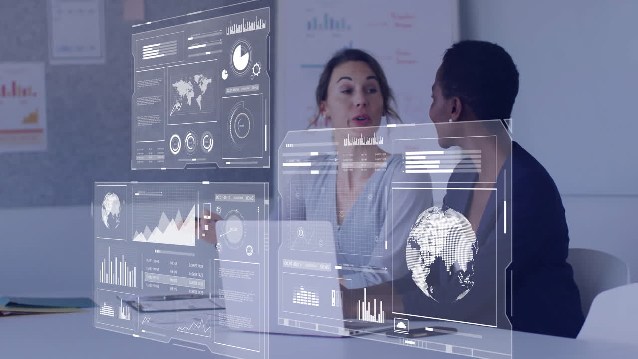 Two business professionals collaborating on laptop while holographic charts floating over world map