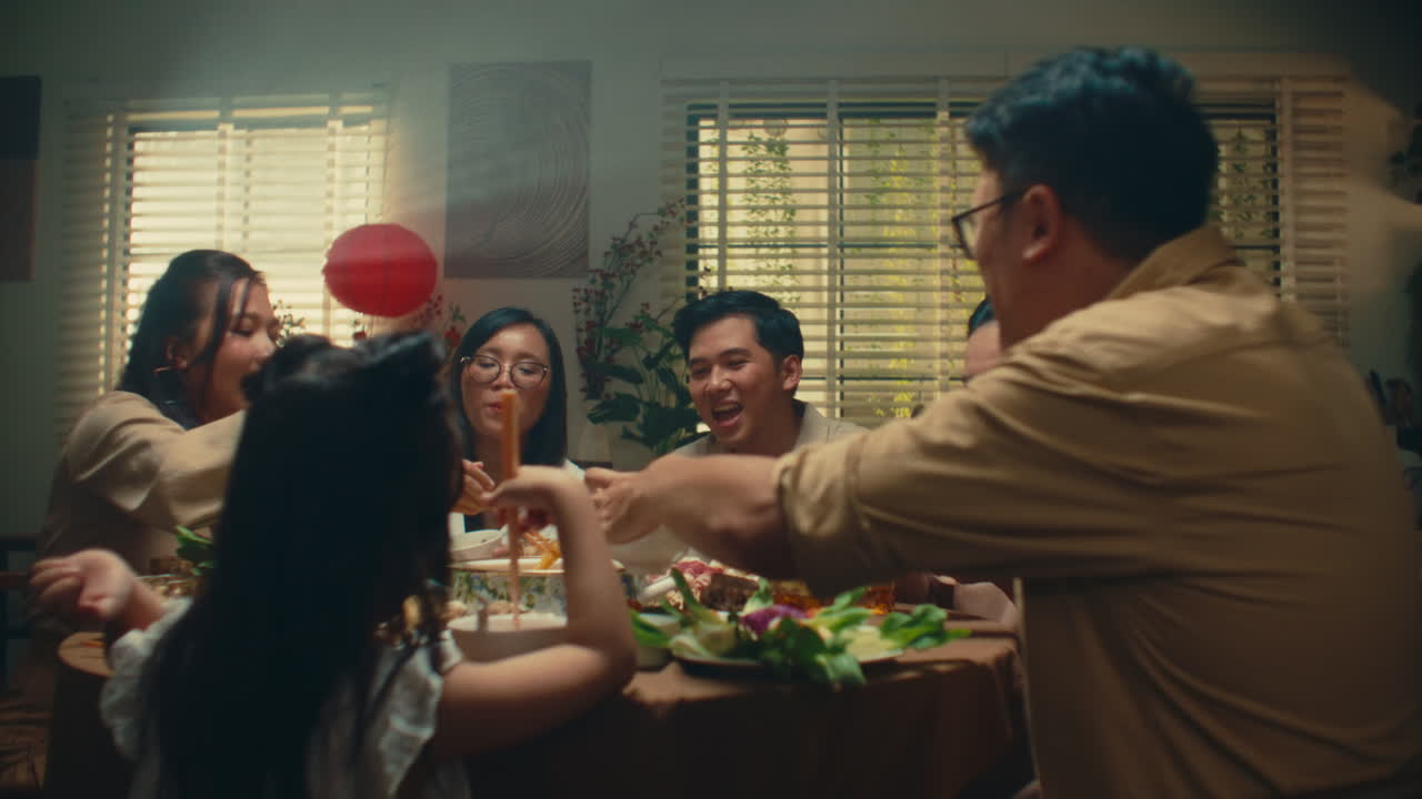Family enjoying a cozy dinner together with laughter and good food