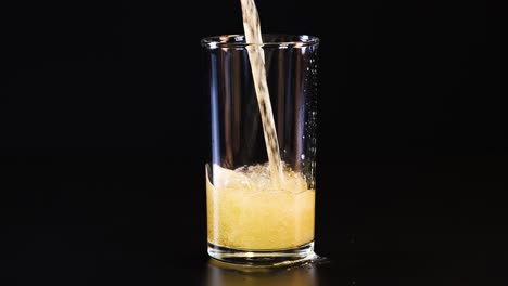 beer being poured and settling in glass