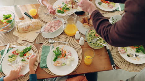 above, food and family at table in home for meal