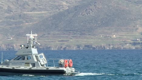 Close-view-of-a-police-marine-boat-driving-across-the-sea-on-the-coast-on-Cyprus