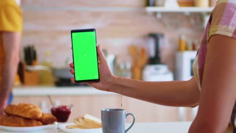 Wife-using-phone-with-green-screen