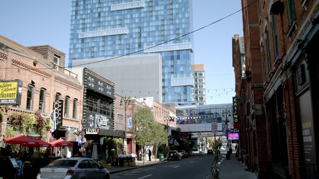 Exterior of Greektown Casino in Greektown Historic District in Detroit, Michigan with wide shot video tilting down.