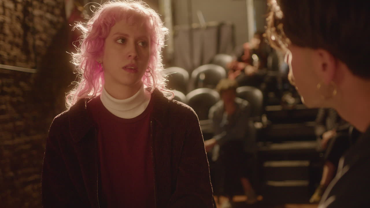 Actress Performing Argument Scene with Partner on Theater Stage