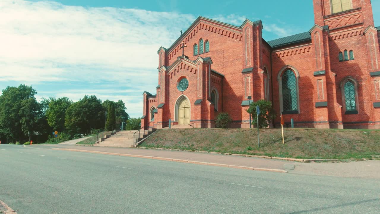 Loviisa Church Facade with Red Brick Completed in 1865. Religious Building in Finland. Wide Angle Shot.