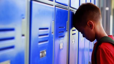 sad schoolgirl leaning on lockers 4k