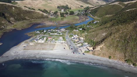 flying towards a small coastal town from over the water