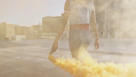 Fashionable-young-woman-on-urban-rooftop-using-a-smoke-grenade