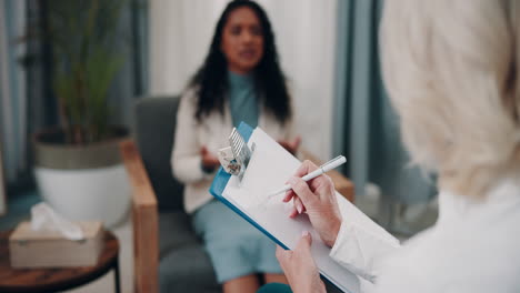 therapist taking notes during a therapy session